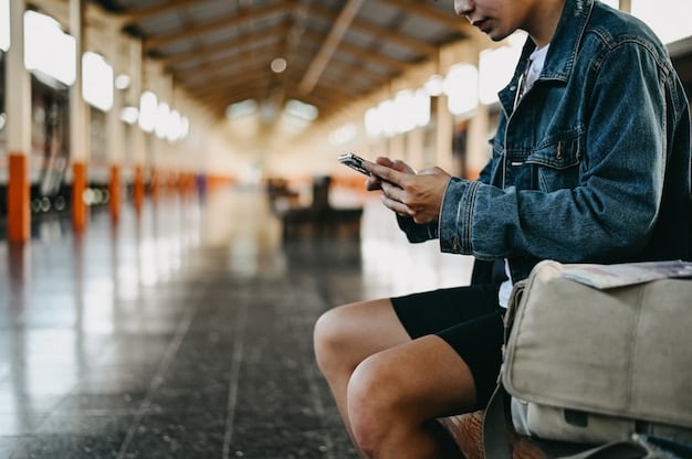 A traveler sitting at an airport gate, looking worried and checking their smartphone, with a suitcase beside them; the background blurred to emphasize the stress of potential travel disruptions.