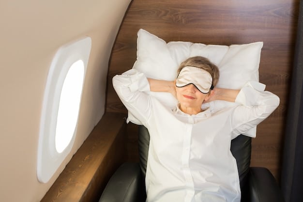 A person wearing a sleep mask on an airplane, trying to sleep, suggesting the challenges of resting during long flights and the need for effective strategies to combat jet lag.