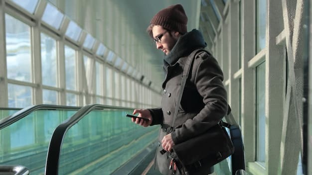 A traveler showing their digital CLEAR card at a dedicated airport security lane, with a biometric scanner in the foreground.