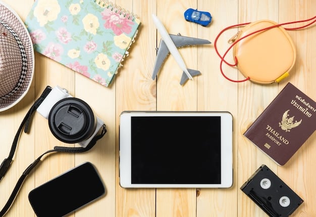 A flat lay of various travel essentials, including a passport, headphones, and a tablet, neatly placed alongside a set of empty packing cubes ready for use.