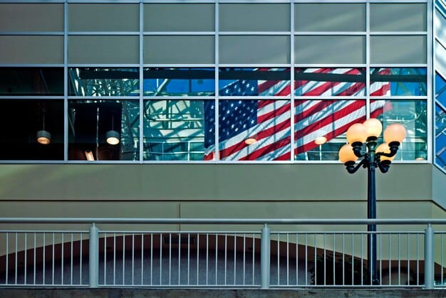 The exterior of a US regional passport agency building, with the American flag waving in front. People are seen entering and exiting the building, suggesting activity and official business.