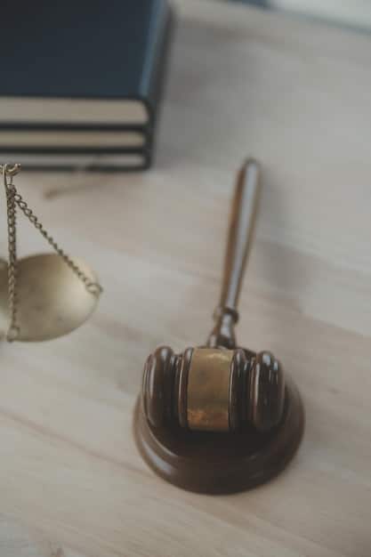 A gavel resting on a stack of legal documents with a blurred background featuring the scales of justice, symbolizing pursuing legal action.