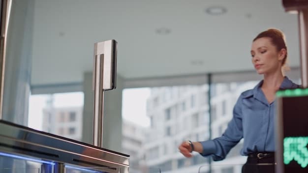 A TSA agent using advanced technology to scan a traveler's boarding pass at a PreCheck lane in an airport.
