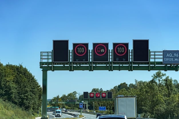 A digital road sign displaying toll rates for different vehicle classes on a highway. The sign also shows information about electronic tolling options and instructions for payment. The image is taken during daylight with clear visibility.