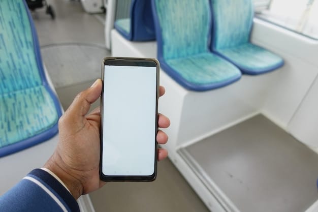 A close-up of an airplane seat with a smartphone displaying a seat map and various colored sections indicating different pricing tiers, held by a person's hand.